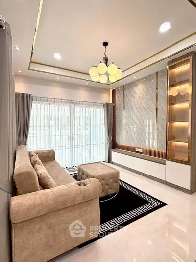 Luxurious living room with elegant sofa, modern lighting, and stylish decor in a bright, spacious setting.