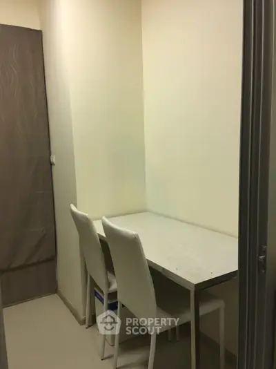 Cozy study nook with minimalist design and two chairs, perfect for focused work or study sessions.