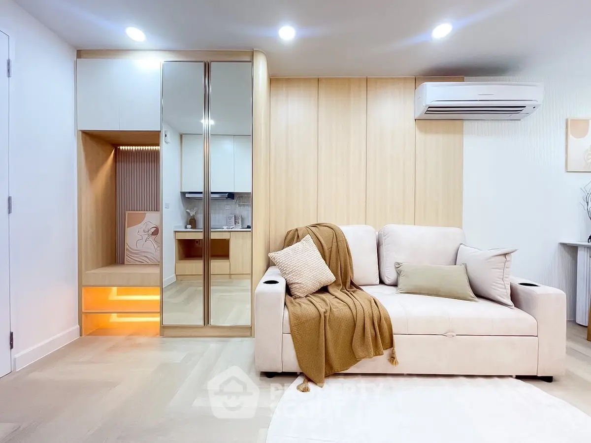 Modern living room with cozy beige sofa and stylish decor