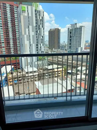 High-rise balcony with urban cityscape view, perfect for modern living.