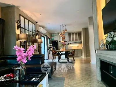 Luxurious open-plan living room with modern kitchen and elegant decor