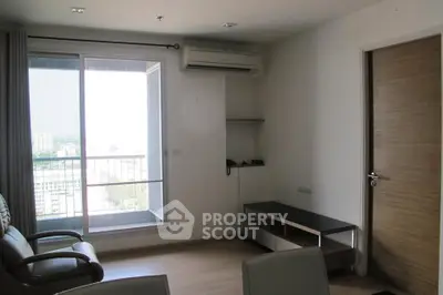 Modern living room with balcony view and air conditioning in urban apartment