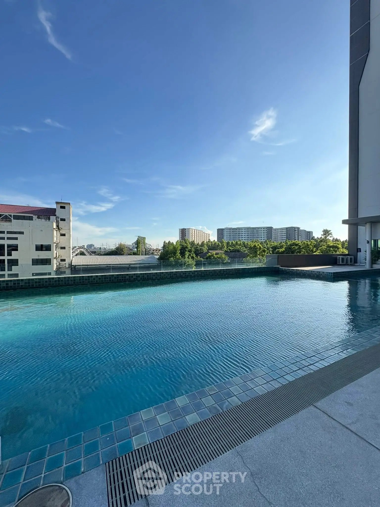 Luxurious rooftop pool with stunning city views and modern design, perfect for relaxation and leisure.