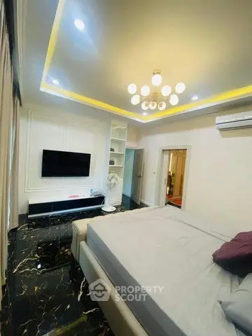 Luxurious bedroom with modern lighting and sleek marble flooring