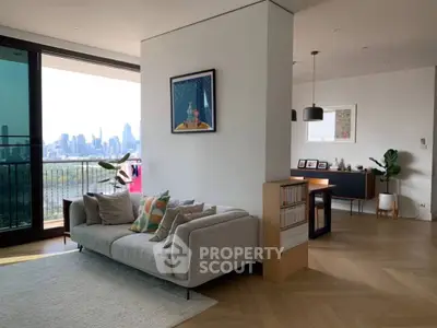 Spacious living room with city view and modern decor