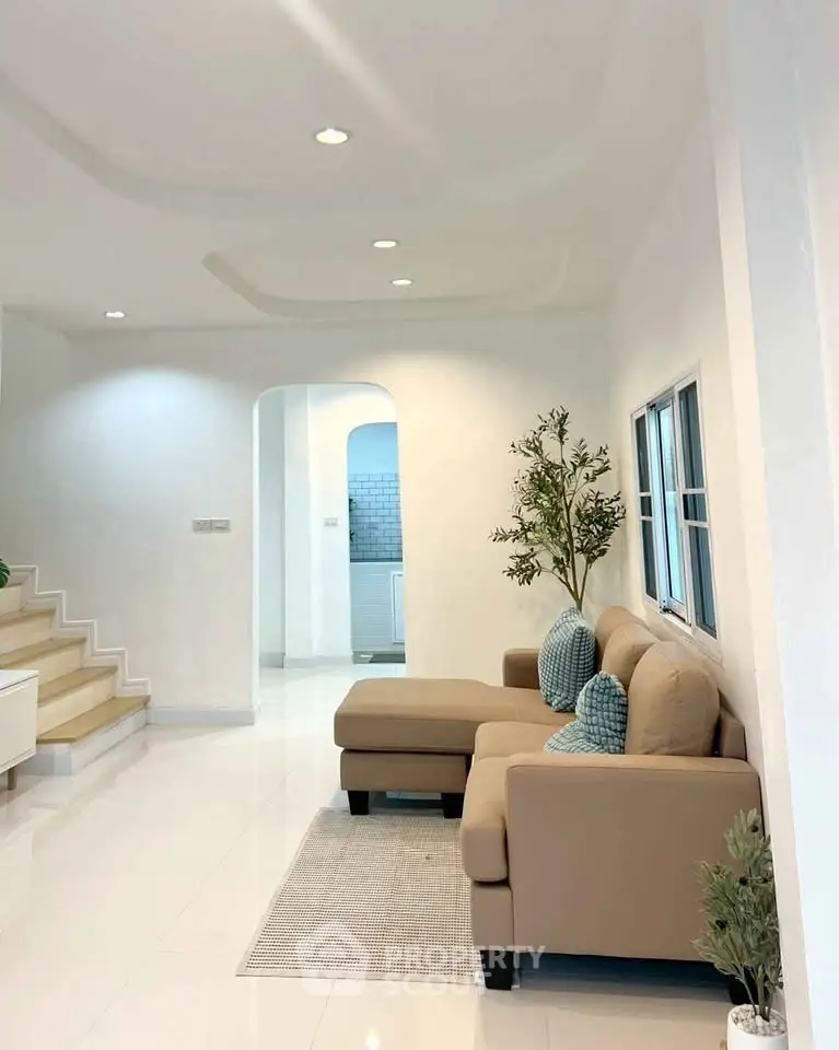 Spacious living room with modern decor and cozy seating area
