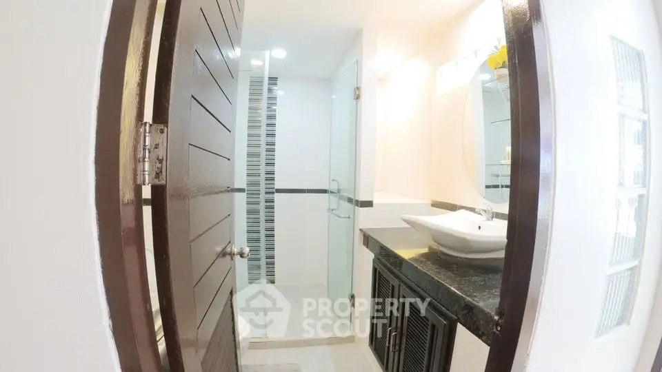 Modern bathroom with sleek design and glass shower enclosure