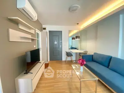 Modern living room with sleek furniture and ambient lighting