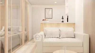 Modern living room with cozy sofa and stylish decor adjacent to a bedroom with glass partition.