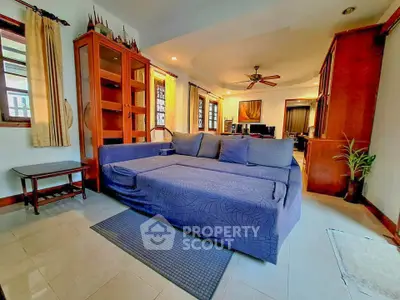 Spacious living room with modern sofa and elegant wooden cabinets