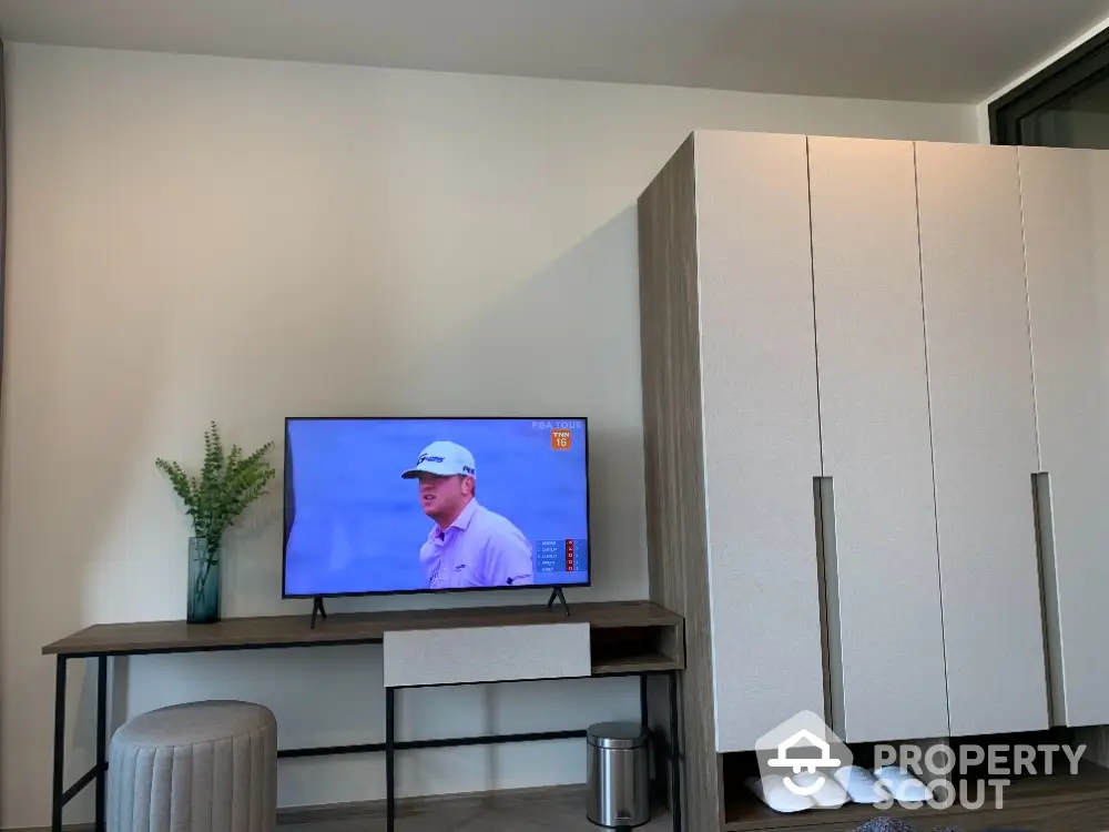 Modern living room with sleek TV stand and wardrobe, perfect for contemporary lifestyle.