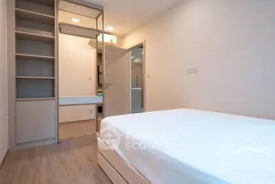 Modern minimalist bedroom with built-in storage and sleek design