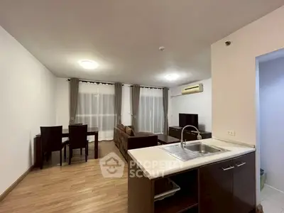 Spacious open-plan living room with modern kitchen and dining area