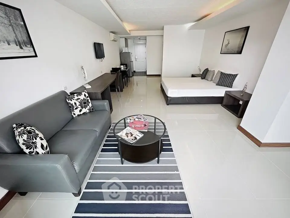 Spacious modern studio apartment with sleek furnishings and open layout, perfect for urban living.