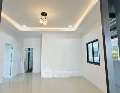 Modern minimalist interior with high ceiling and sleek lighting