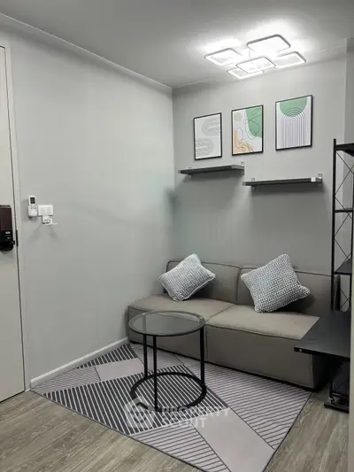 Modern living room with stylish decor and cozy seating area, perfect for relaxation.