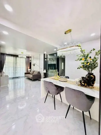 Luxurious open-plan living room with elegant decor and modern furnishings.
