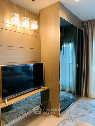 Modern living room with sleek TV setup and elegant lighting