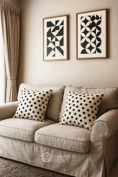Cozy living room with stylish sofa and geometric wall art, perfect for modern home decor.