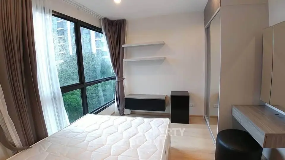 Modern bedroom with large window and minimalist decor
