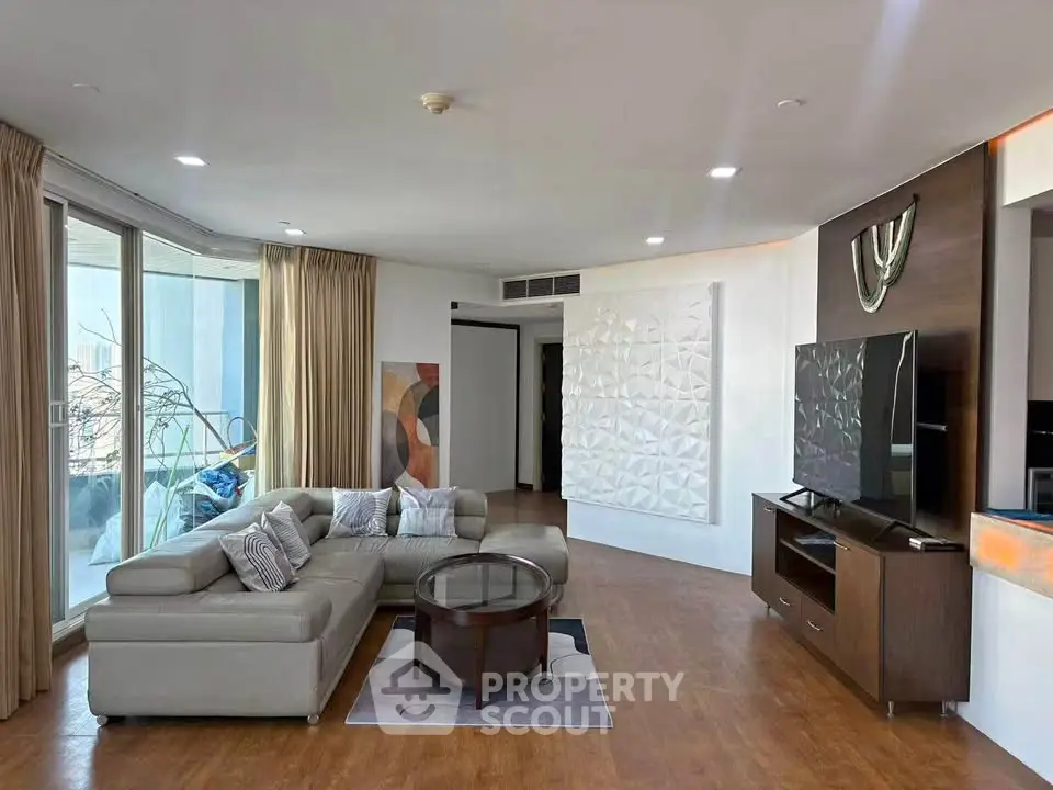 Spacious modern living room with stylish decor and large windows