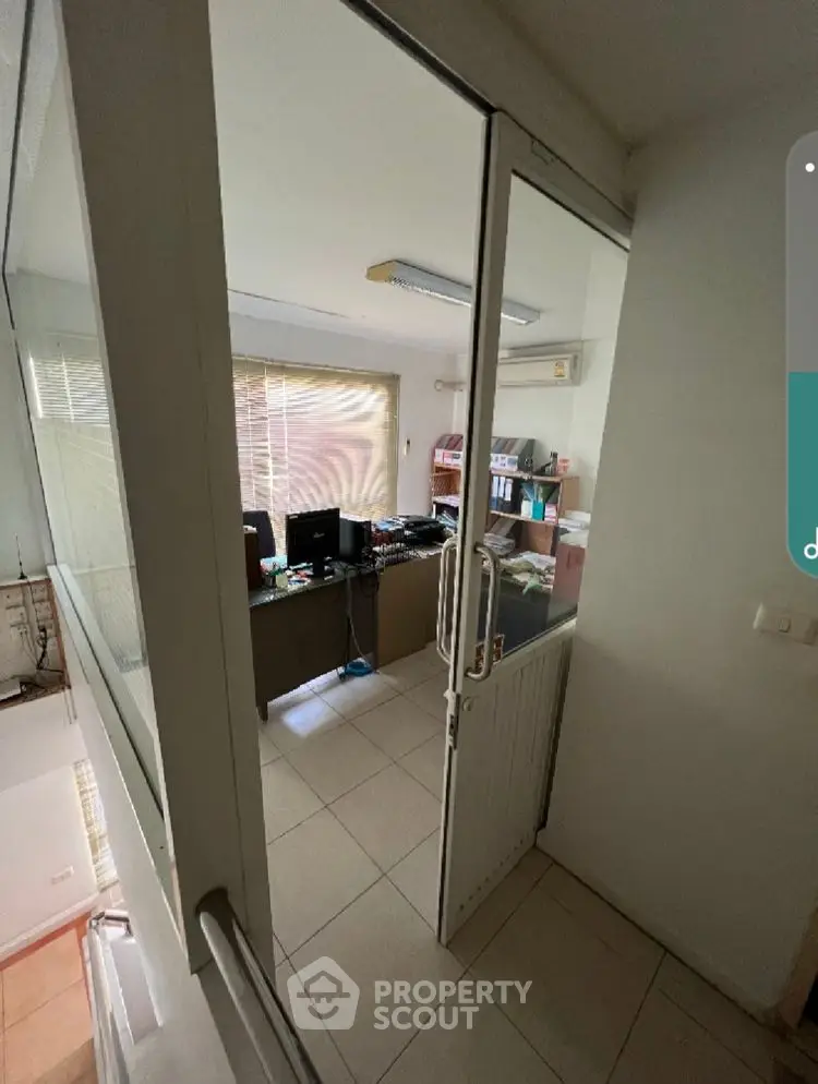 Modern office space with natural light and organized workspace