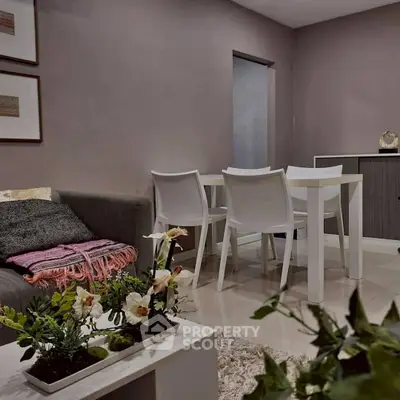 Modern living room with cozy seating and elegant dining area