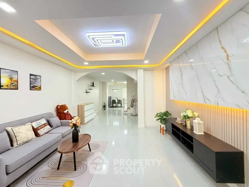 Modern living room with stylish ceiling lights and elegant decor