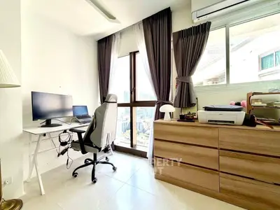 Modern study room with large window and sleek furniture