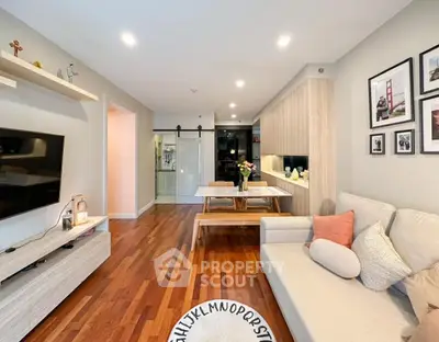 Modern living room with wooden flooring and stylish decor