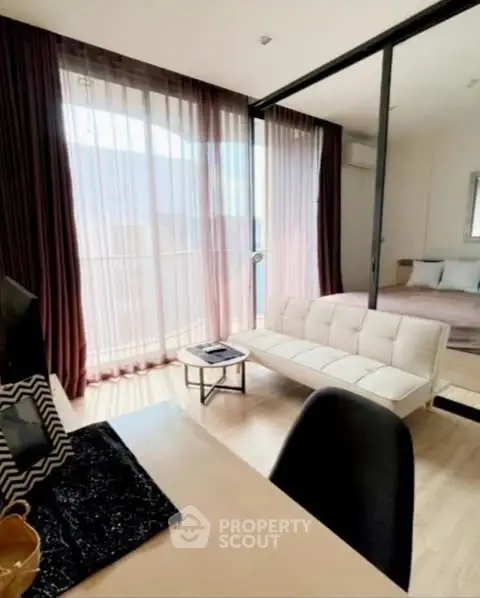 Modern studio apartment with glass partition and cozy decor