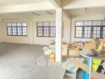 Spacious storage room with large windows and ample natural light