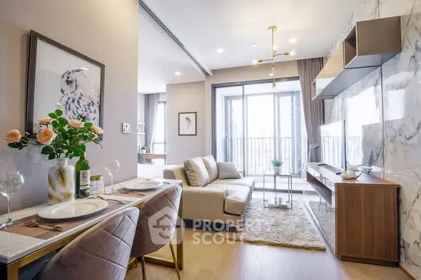 Modern living room with elegant decor and large windows offering natural light