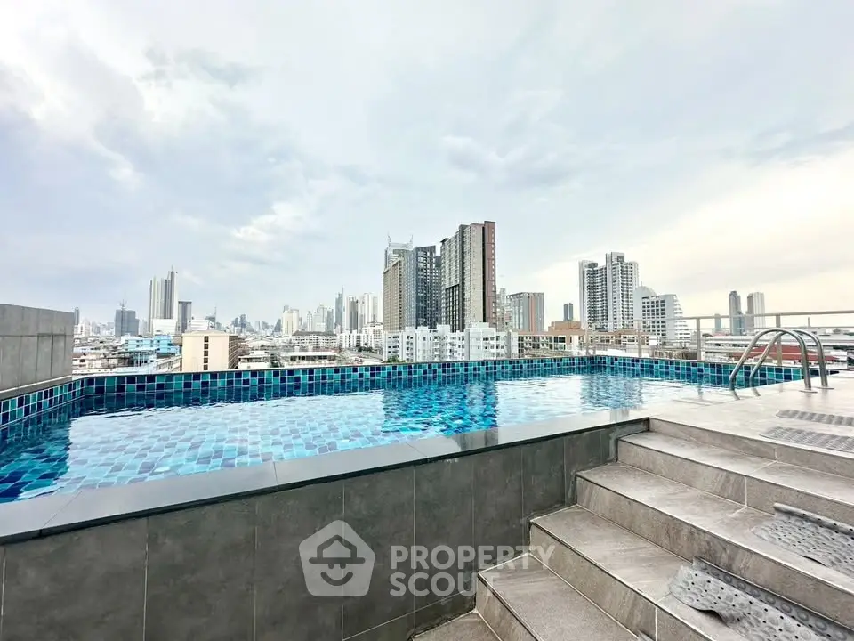 Stunning rooftop pool with panoramic city skyline views