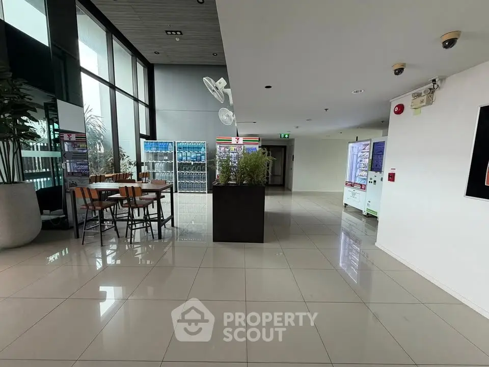 Modern building interior with vending machines and seating area