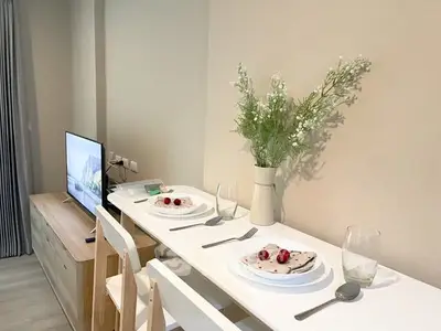Modern dining area with minimalist decor and natural light