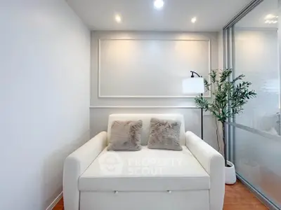 Cozy modern living room with white sofa and stylish decor