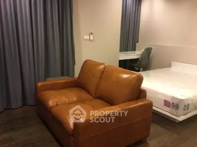 Cozy studio apartment with leather sofa and modern decor