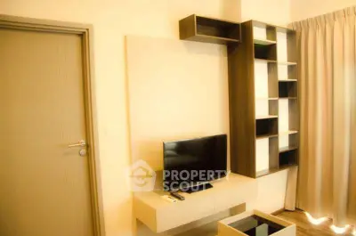 Modern living room with sleek TV unit and stylish shelving