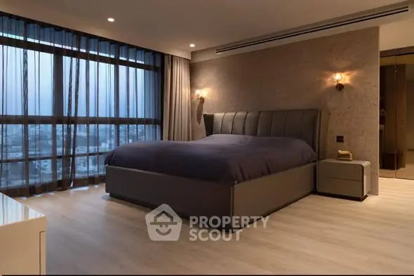 Luxurious modern bedroom with large windows and elegant lighting