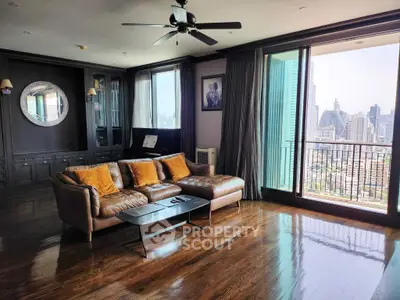 Luxurious living room with city view and elegant decor in high-rise apartment