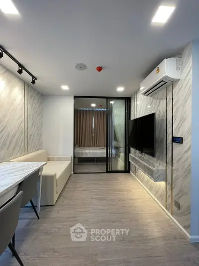 Modern living room with marble accents and sleek furniture