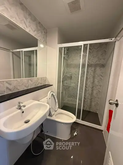 Modern bathroom with sleek shower and stylish tile design