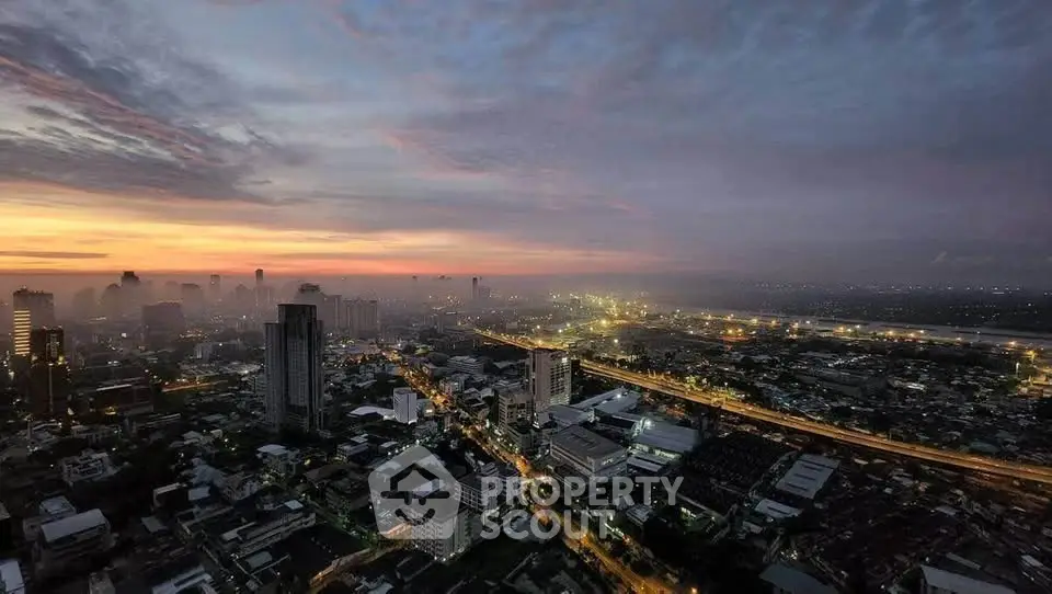 Stunning cityscape view at sunset showcasing urban skyline and vibrant city lights.