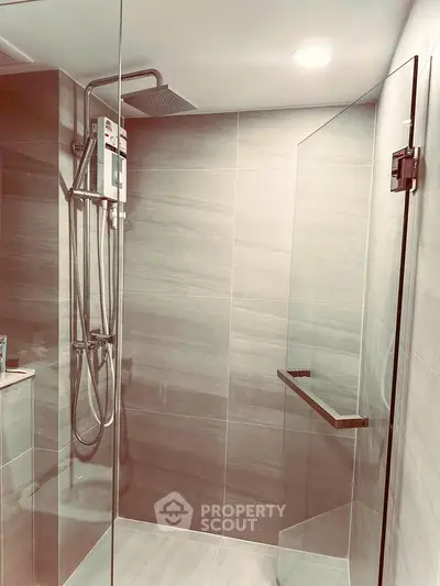 Modern bathroom with sleek glass shower and contemporary fixtures