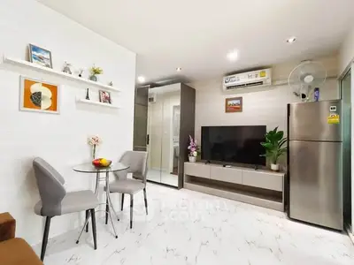 Modern living room with sleek decor, air conditioning, and stylish furniture in a contemporary apartment.
