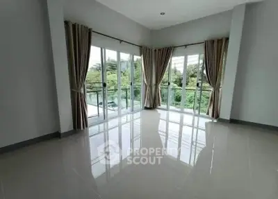 Spacious corner unit with large windows offering lush green views and abundant natural light.
