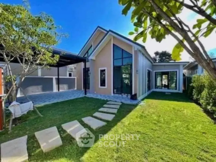 Modern house with spacious garden and large windows in a serene neighborhood