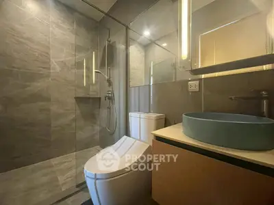 Modern bathroom with sleek design and glass shower enclosure