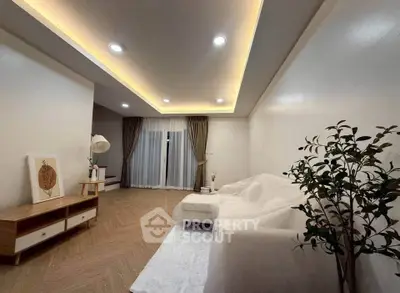 Elegant living room with modern lighting and cozy decor